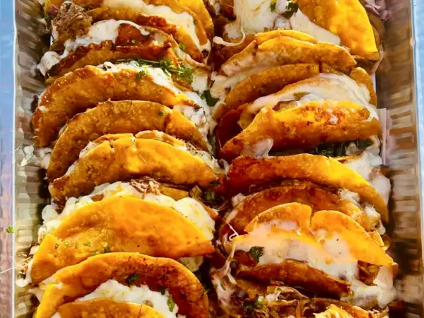 Beef and chicken birria taco catering tray